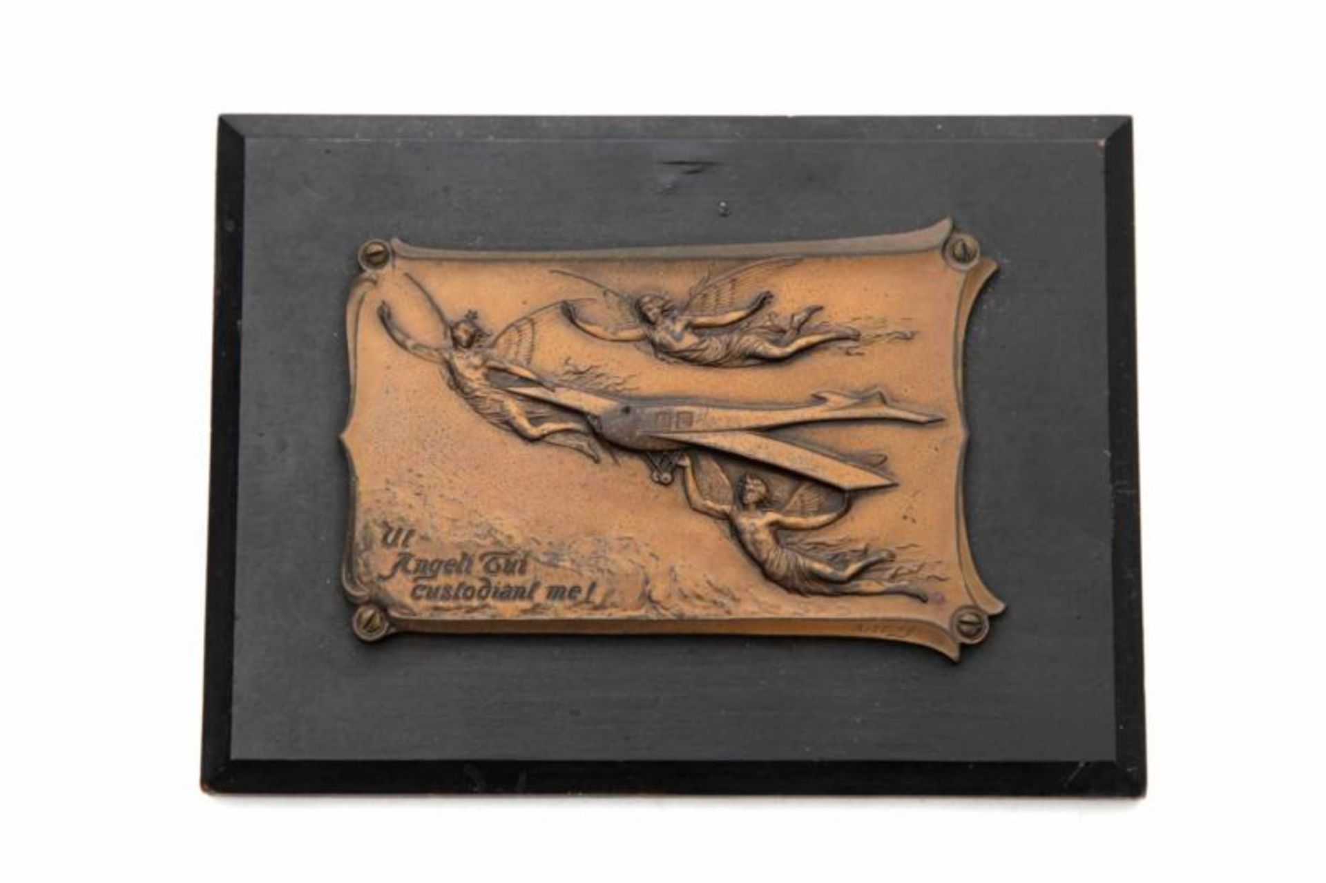 Art Nouveau A bronze coloured metal plaque mounted to a ebonised wooden panel, depicting three