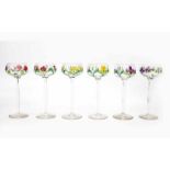 Jugendstil Six wine glasses on high stem, all with different enamelled floral pattern and gilt top