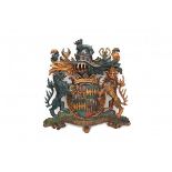 A carved wooden coloured, part gilt coat of arms, Duke of Northumberland. 19th century. The motto’s