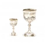 Two German silver kiddoesj cups. 20th century.Hoogte 12,5 en 8 cm. 29.00 % buyer's premium on the