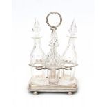 A Dutch silver four-bottle cruet stand. Year letter 1833. With four non matching bottles.Hoogte 26