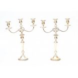 A pair of weighted American sterling silver three-light candelabras. Marked Prelude International