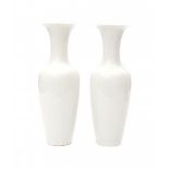 KPM, BerlinTwo white porcelain vases, both signed with manufacturer's marks underneath, one incised