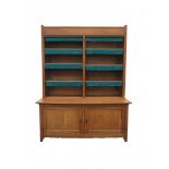 H. Pander & Zonen N.V.An oak Nieuwe Kunst bookcase, the lower compartment with two doors,