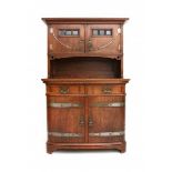 Darmstadt StyleAn oak sideboard with brass mounts and small facet cut glass panes in copper frame,