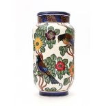 Aluminia, CopenhagenA tall ceramic vase decorated with birds amidst foliage, circa 1901/1902,