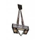 Art DecoA wrought iron hanging lamp, the metal decorated with stylized floral pattern, with milky-