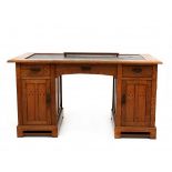 Nieuwe KunstAn oak twin-pedestal desk with geometric ebony inlay and brass mounts, circa 1910, in