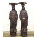 Pair of oak sculptures, figures holding crests, 19th century, crests decorated with the star of