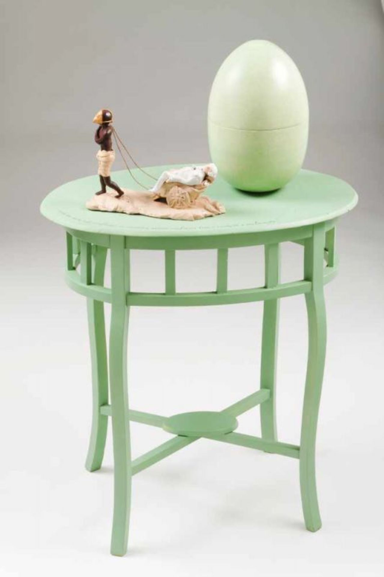 Vasco Araújo (n. 1975) Untitled From "Debret" series Sculpture with painted wood table and egg,