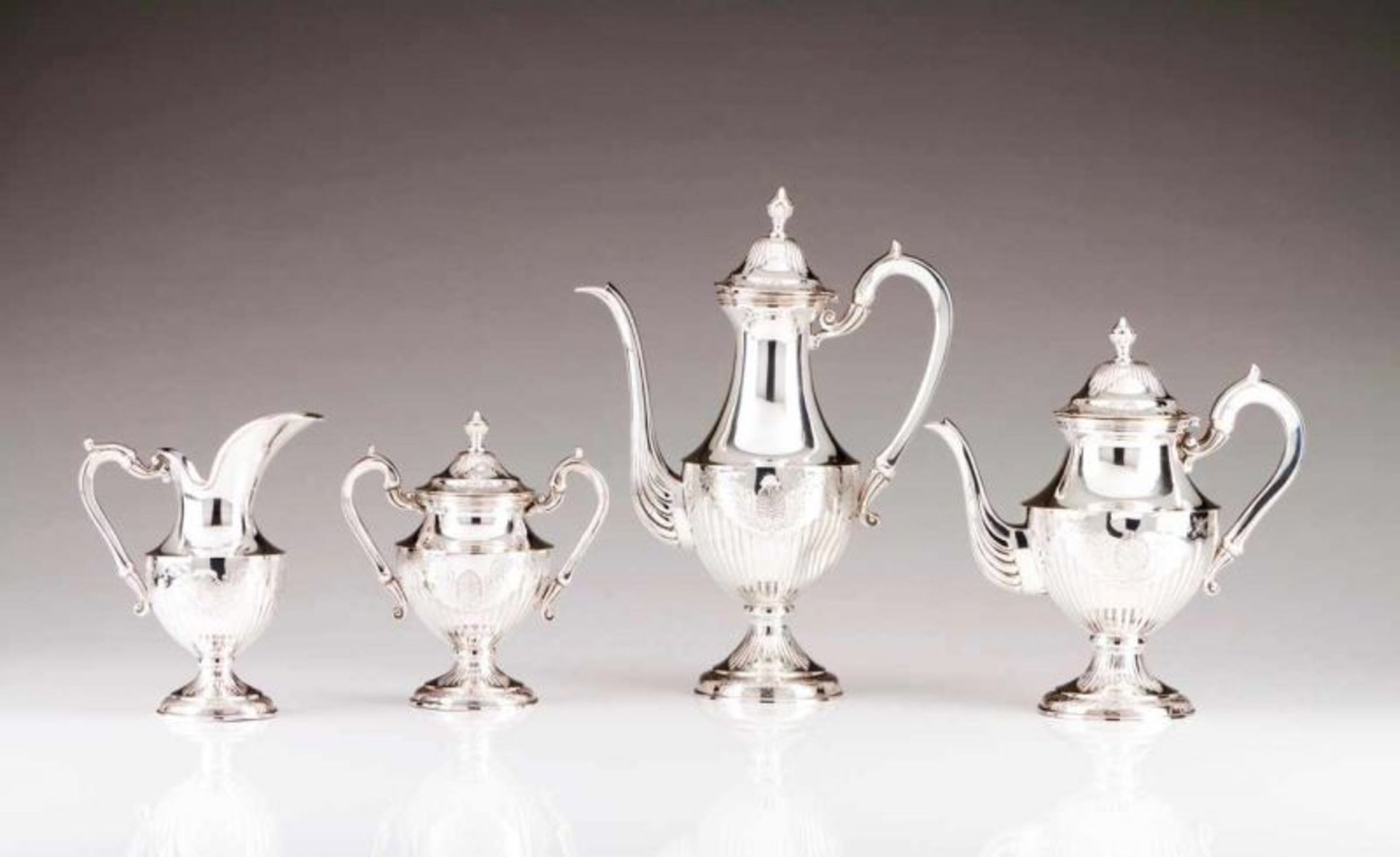 A coffee and tea set Portuguese silver Fluted decoration with engraved floral motifs and shells