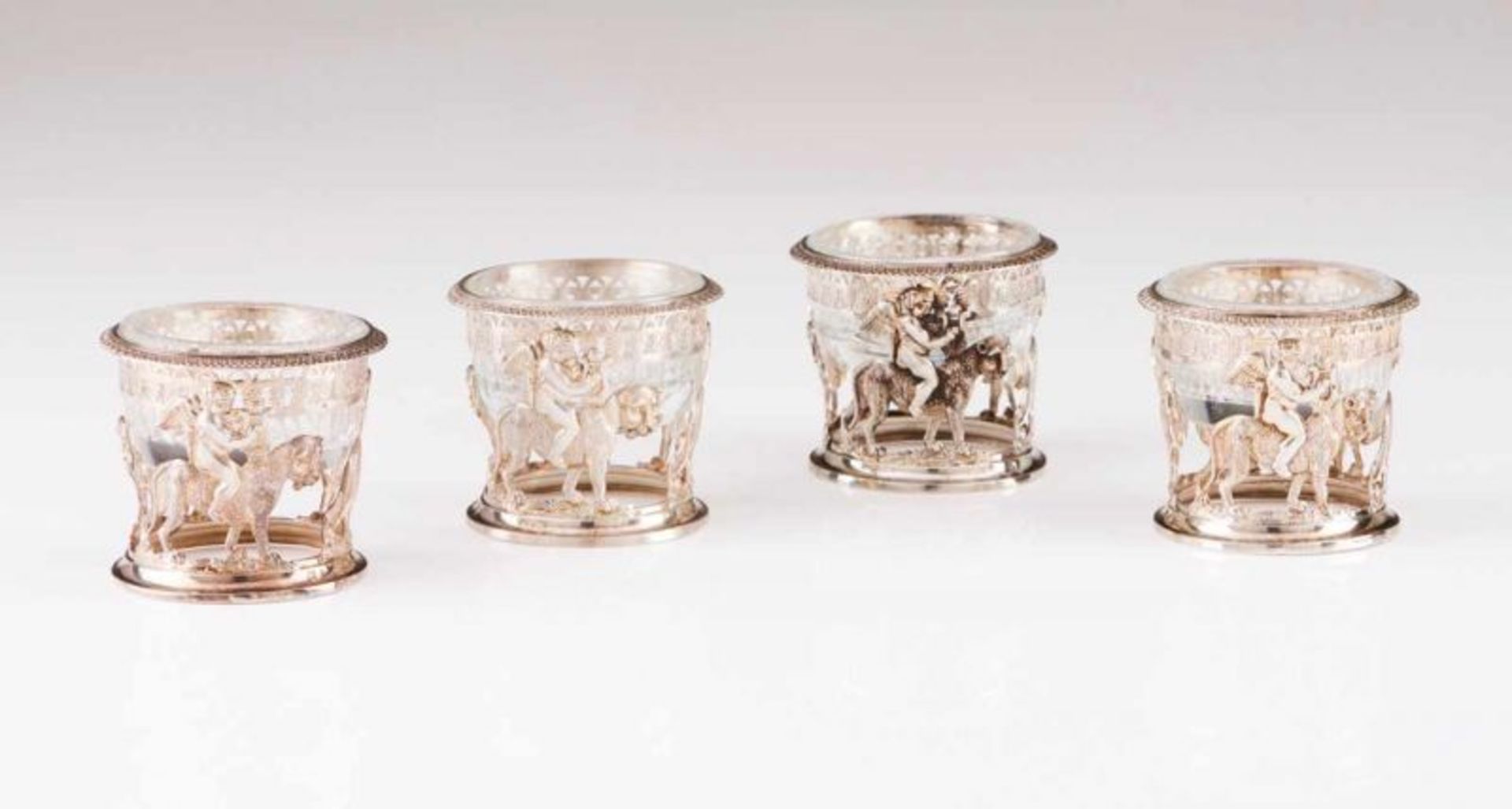 Four Louis XVIII salt cellars French silver frames decorated in relief with friezes with grapes and