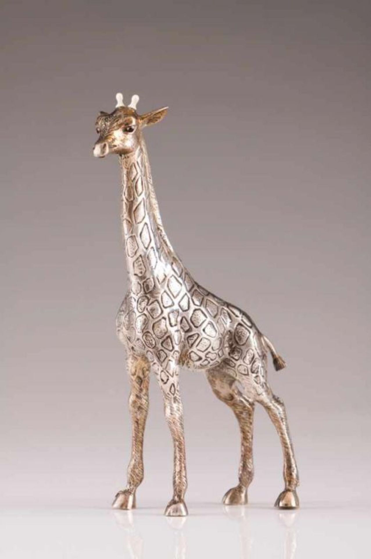 A giraffe, LUIZ FERREIRA A silver sculpture Realistic decorates, bone horns Porto assay mark (after