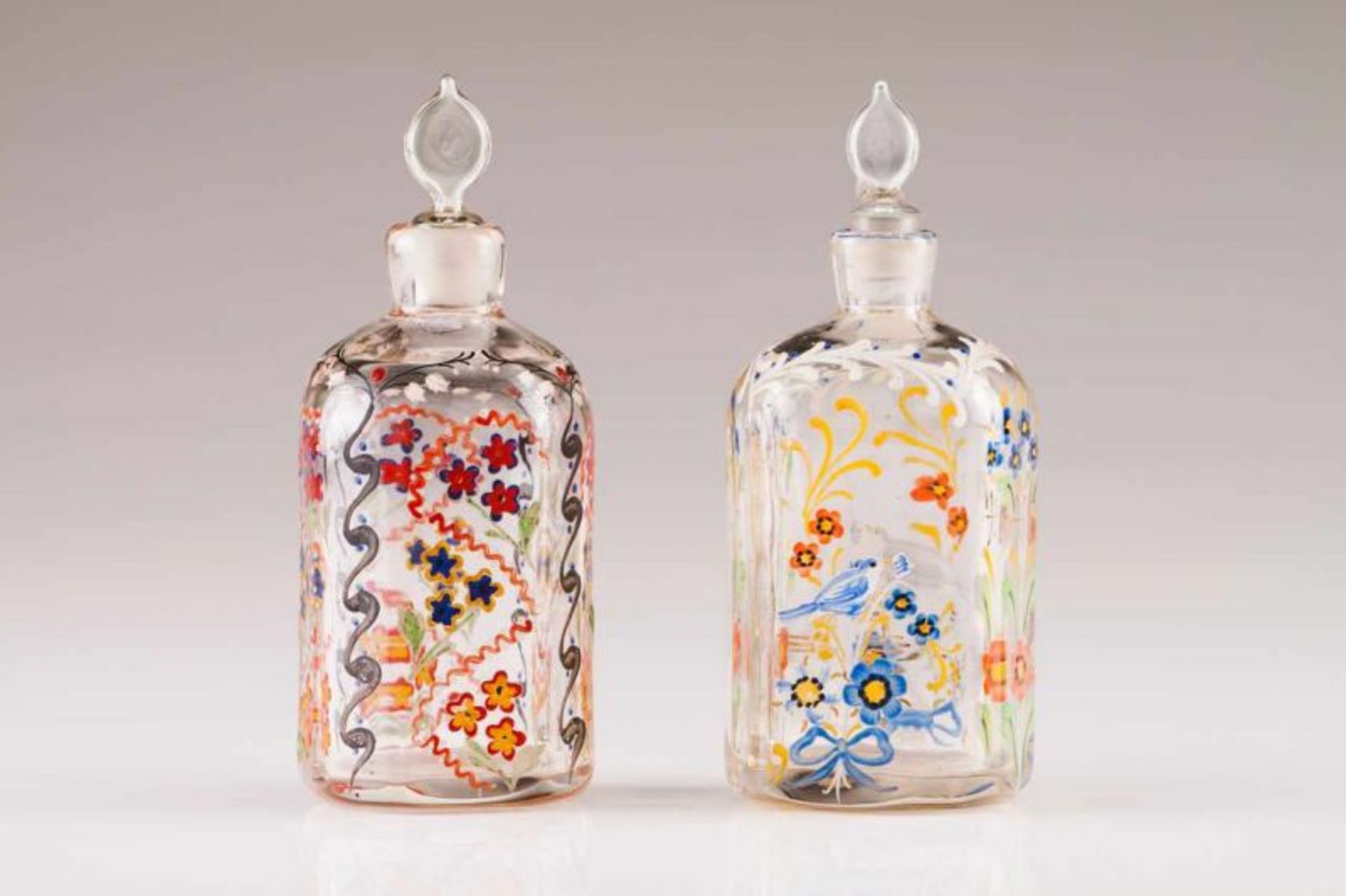 Two bottles Bohemian glass Painted decoration with floral motifs 18th century Height: 15 cm