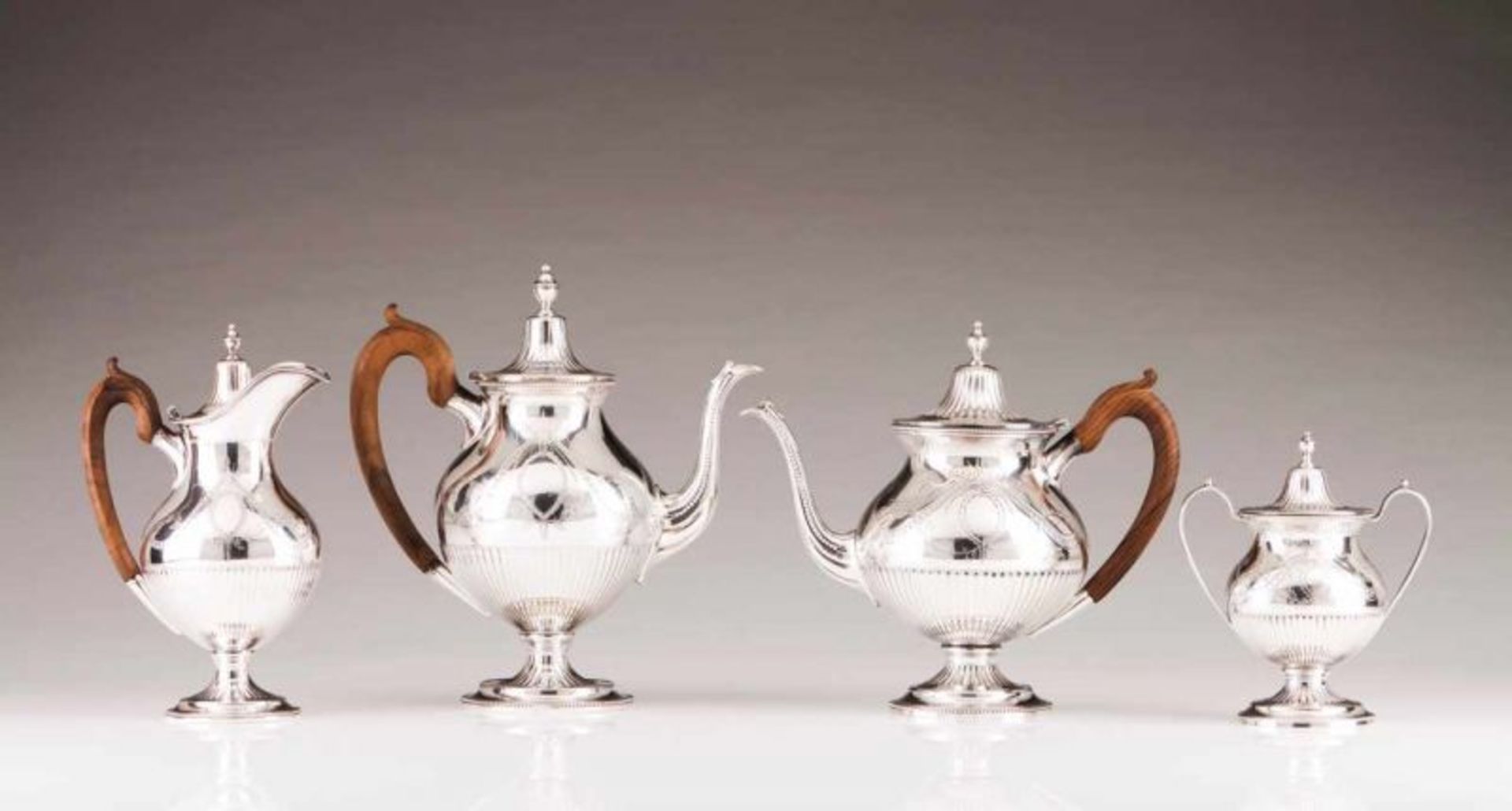 A coffee and tea set in the D. Maria manner Portuguese silver Partly fluted and engraved decoration