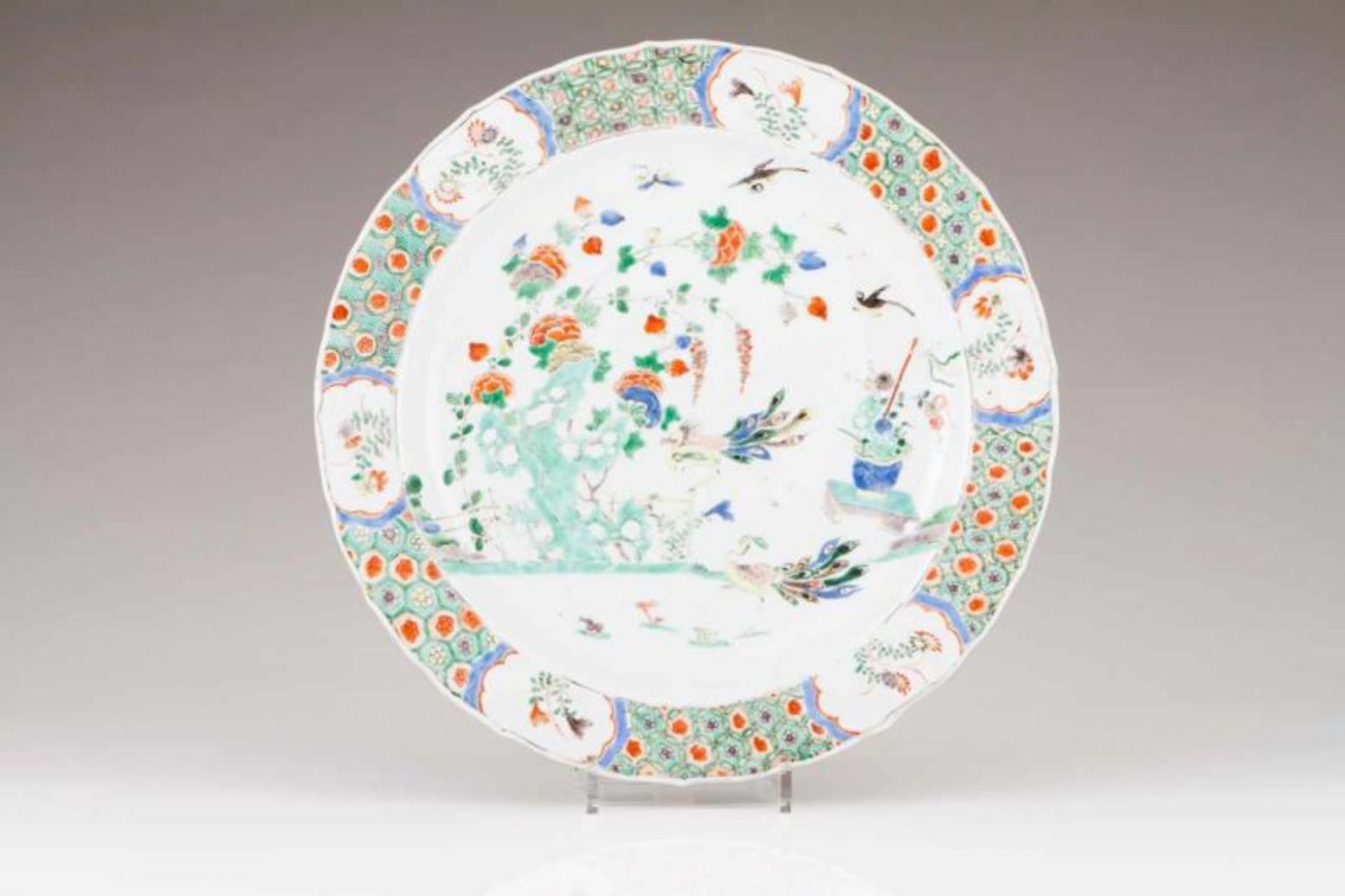 A scalloped charger Chinese porcelain Polcyhrome Famille Verte decoration depicting garden view
