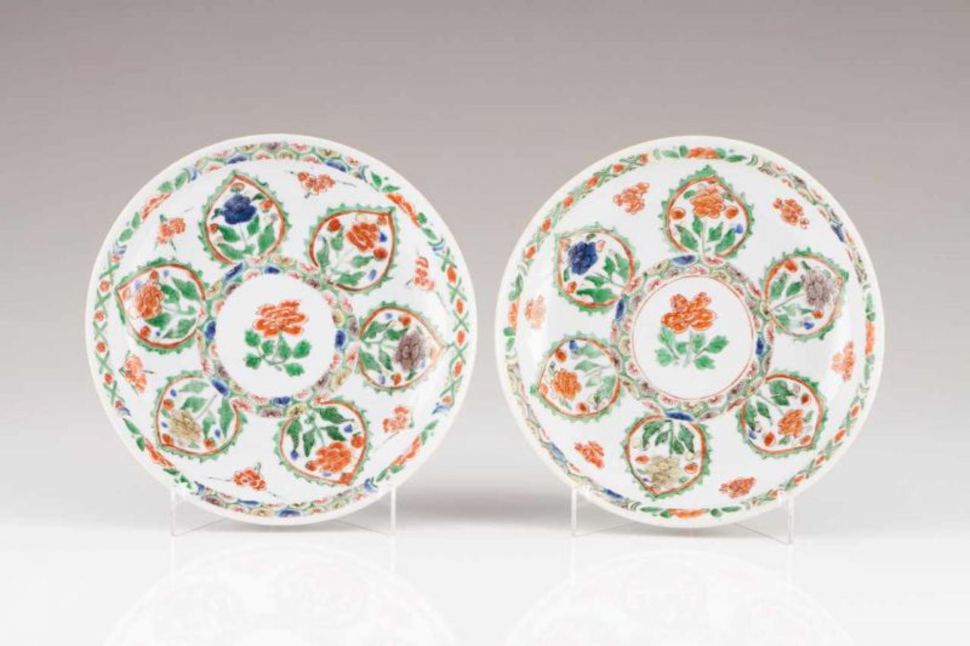 A pair of saucers Chinese porcelain Polychrome Famille Verte decoration depicting flowers Marked at