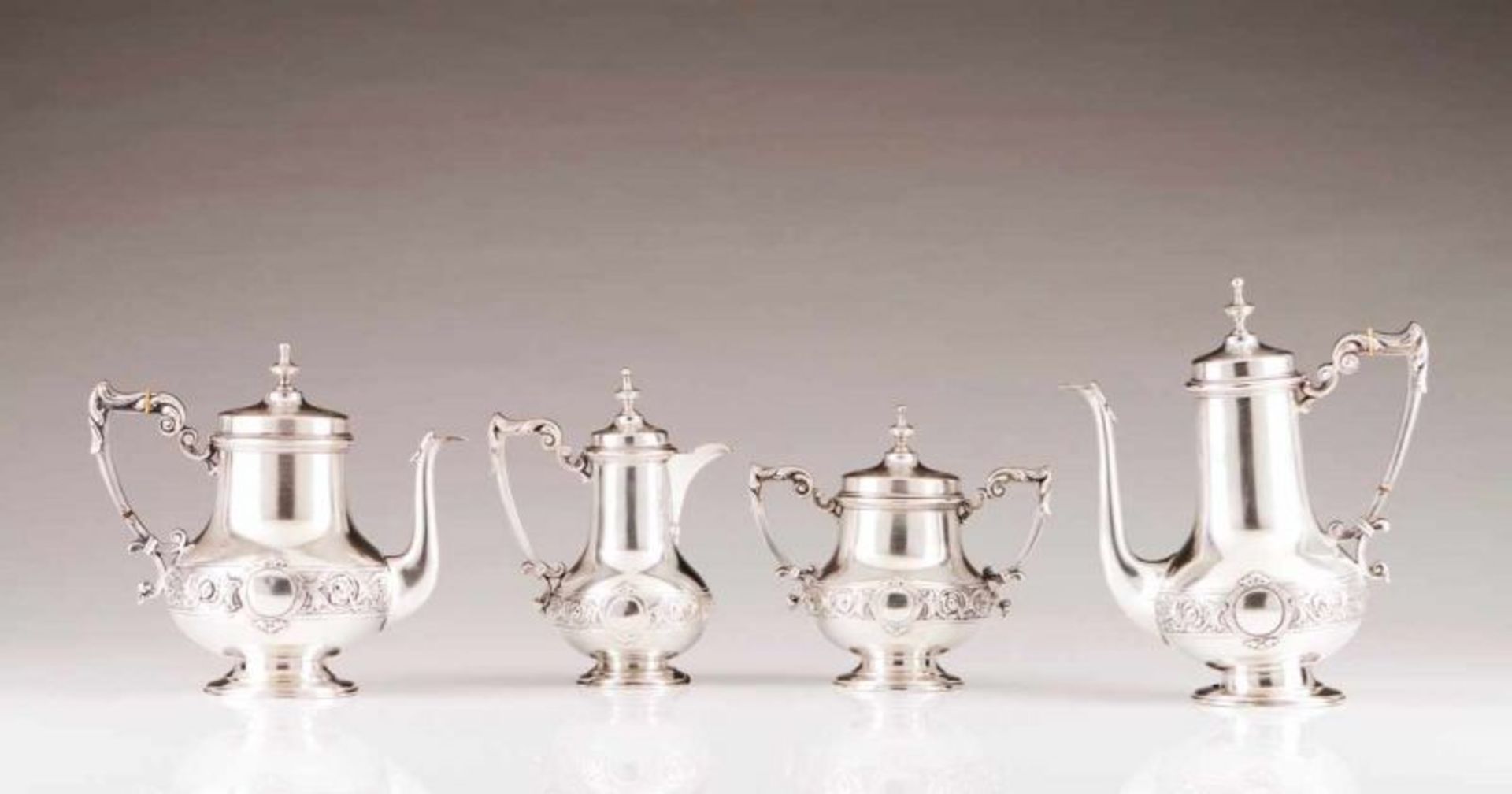 A Belle Epoque coffee and tea set Portuguese silver of the late 19th, early 20th century Decorated