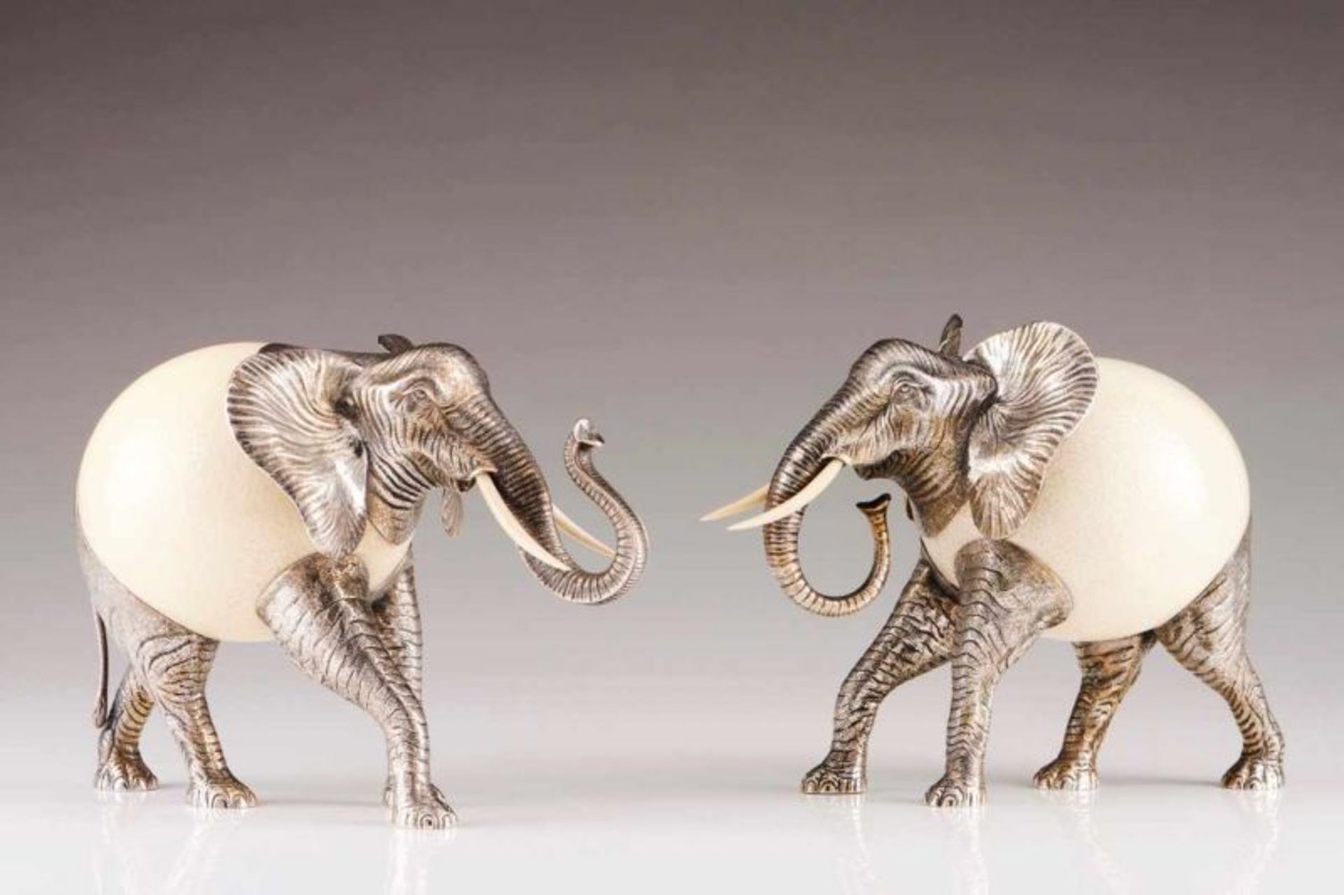 Elephant A Portuguese silver sculpture, ostrich egg body, ivory tusks Porto assay mark (after 1985)