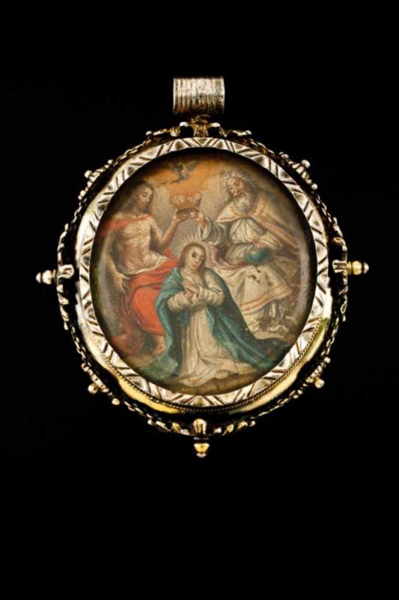 A Mannerist style medallion Silver gilt decorated in relief with floral clusters and geometric