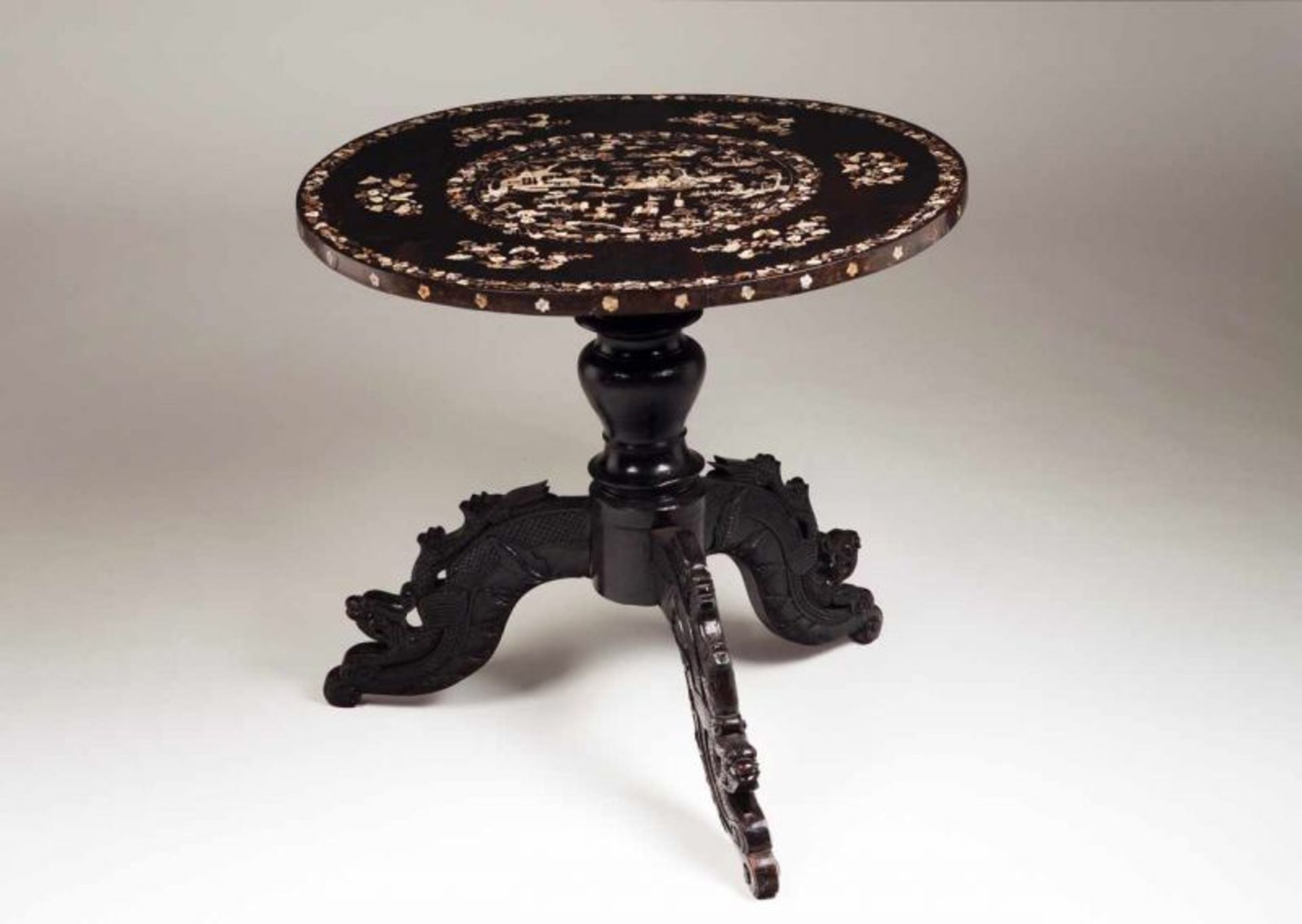 A table Ebonized wood Richly decorated top with mother-of-pearl inlays depicting bouquets and
