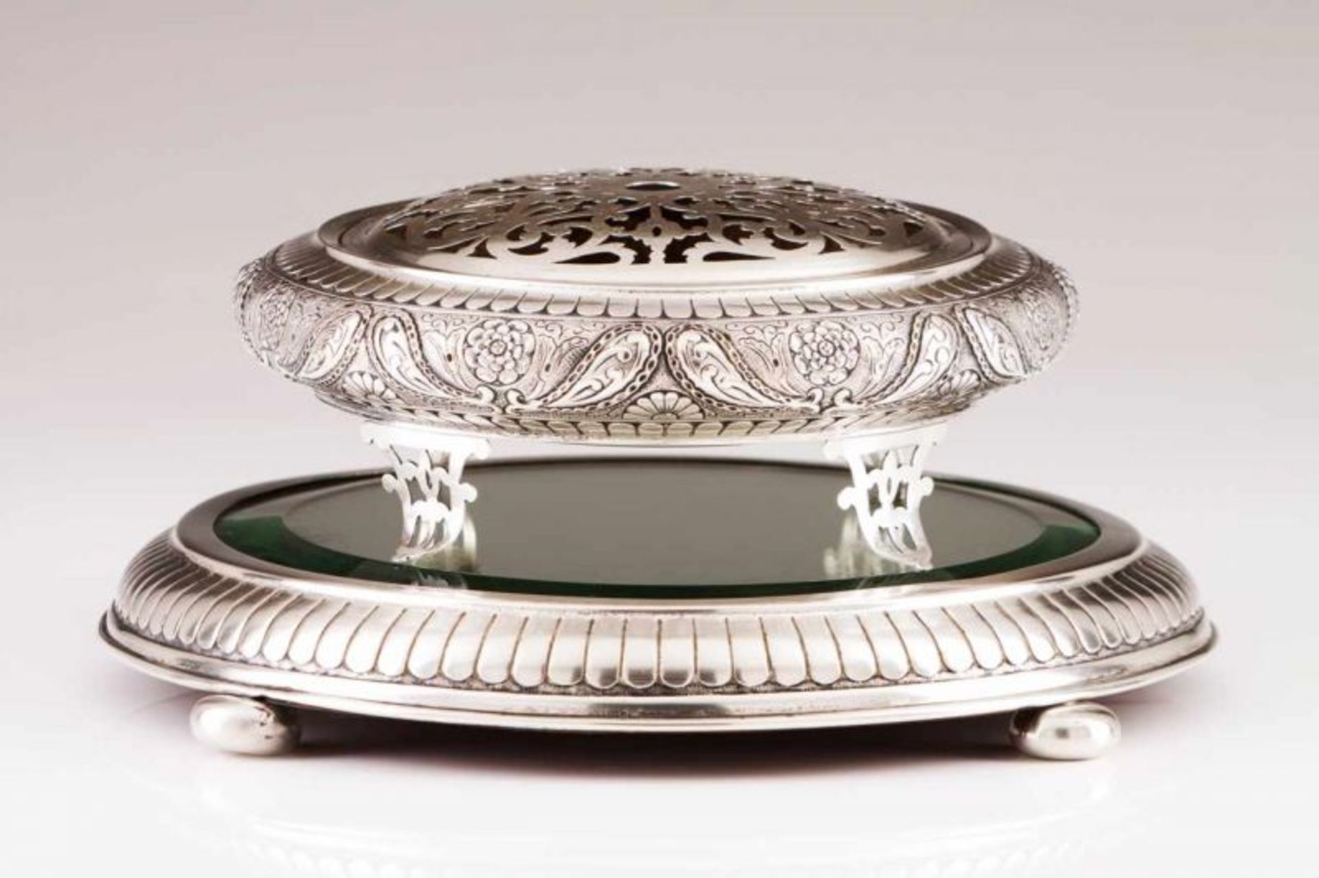 A centre piece with stand Portuguese silver Round with decoration in relief depicting floral