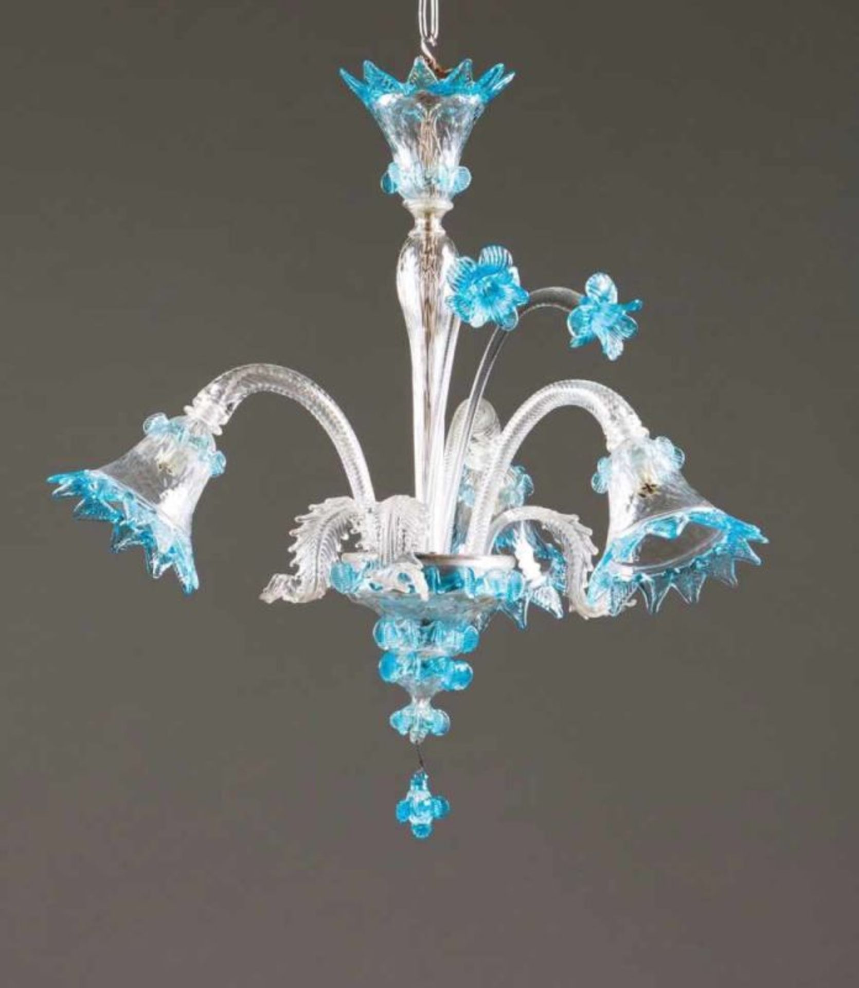 A three-light chandelier Murano glass Molded decoration with leaves Italy, 20th century Height: 57