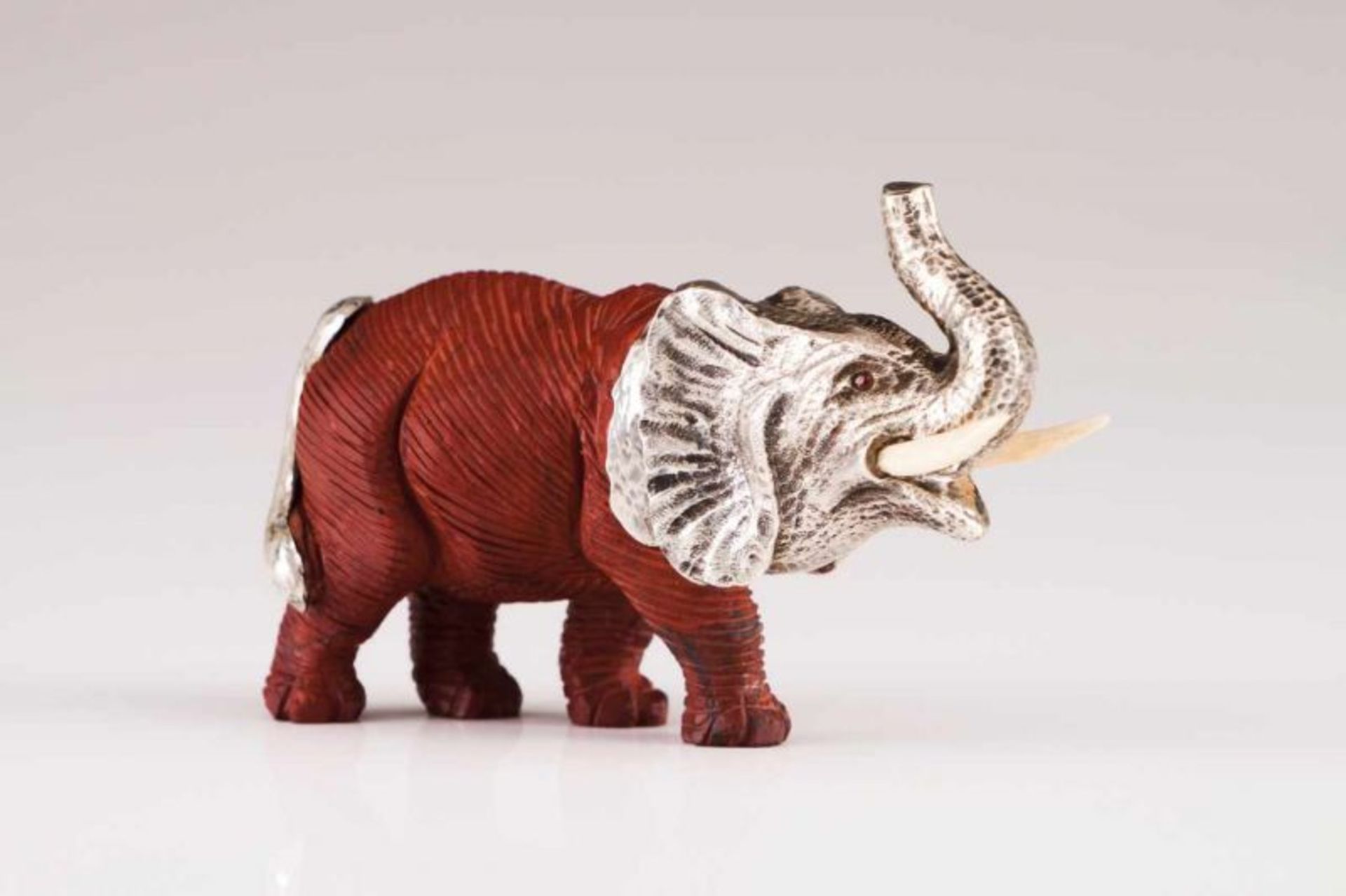 Elephant, LUIZ FERREIRA Red hardstone and silver sculpture, ivory tusks Porto assay mark (after