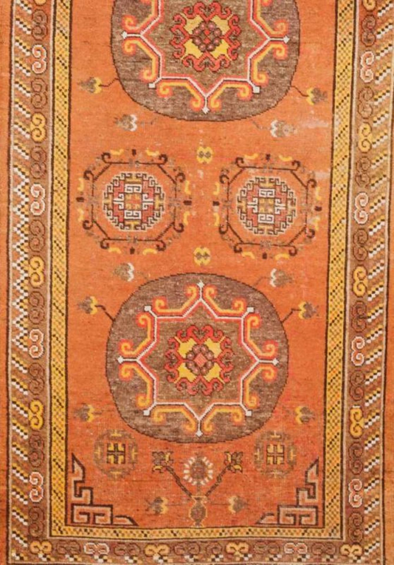 A Samarkanda carpet, Uzbekistan Cotton and wool with geometric decoration in orange and brown (