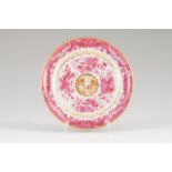 A plate Chinese export porcelain Ruby Fitzhug decoration with scroll frame and gilt cartouche with