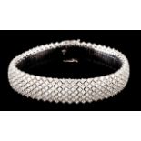 A large diamond bracelet Set in white gold with 495 brilliant cut diamonds (ca. 10,00ct) Slightly