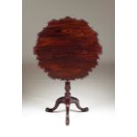 A scalloped tripod table Rosewood Carved decoration Tilt-top Portugal, 19th century 75x76 cm