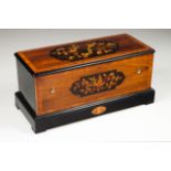 A "orchestra" music box With 12 melodies Wood case with rosewood, boxwood and other woods