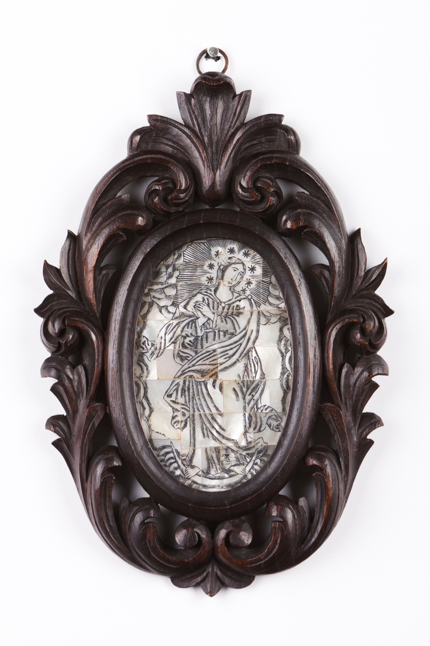 Our Lady of the Conception Engraved mother-of-pearl Ebonized and carved wood frame with floral