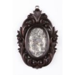 Our Lady of the Conception Engraved mother-of-pearl Ebonized and carved wood frame with floral