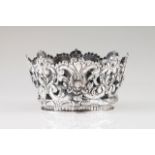 Crown Silver decorated in relief and pierced with volutes, floral motifs and winged angel heads