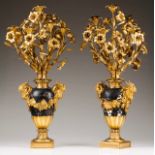 A pair of large seven-light candelabra Gilt and patinated bronze Amphora-shaped bases decorated with