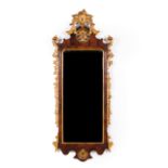 A D. José style mirror Rosewood veneered wood Carved and gilt decoration Portugal, 19th century