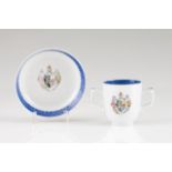 A double handled cup and saucer Chinese export porcelain Blue decoration depicting European coat-