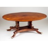 A centre table Walnut Oval top and scalloped feet with castors 19th century 68x172x134 cm