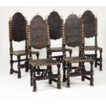 A set of five tall back chairs Ebonized wood Engraved leather backs and seats with brass pins,