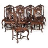 A set of twelve D. José style chairs Walnut Two armchairs, scalloped backs Engraved leather seats (