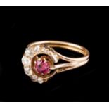 A "crescent" ring Set in gold with one old mine cut ruby, rose cut diamonds and three old mine cut
