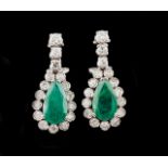 A pair of earrings Set in white gold with two pear-shaped emeralds, 26 single cut diamonds and 6