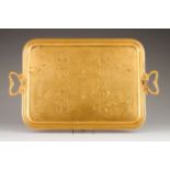 A gilt tray, CHRISTOFLE Rectangular with chased handles, profusely engraved with geometric and