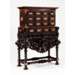 A large cabinet Rosewood Two bodies, upper part with eleven drawers simulating eighteen; lower