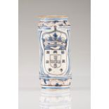 A Pharmacy beaker Portuguese faience Blue decoration depicting flowers and animals Centre bearing