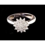 A diamond ring Set in white gold with small brilliant cut diamonds Portuguese assay mark (after