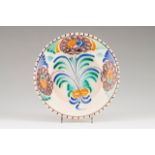 A plate Coimbra faience, known as "Ratinho", 19th century Polychrome and vinous decoration with