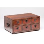 A cabinet Rosewood Decorated with ivory friezes Four drawers simulating six Cast iron mounts and